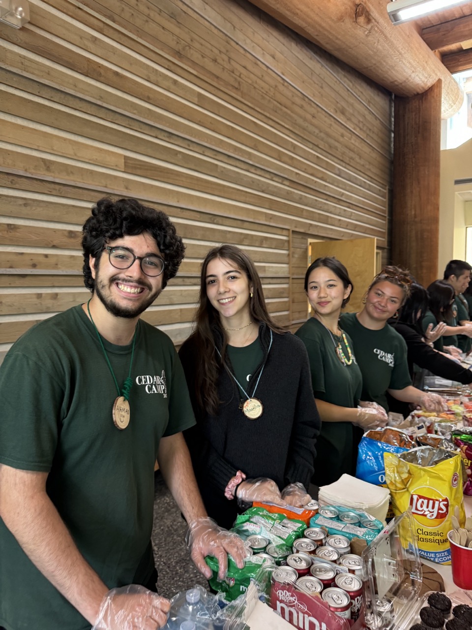 A group of volunteers smile at the camera.